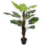 Artificial potted plant with large green leaves on a white background