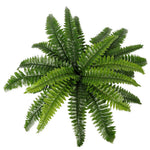 Artificial green fern leaf on a white background