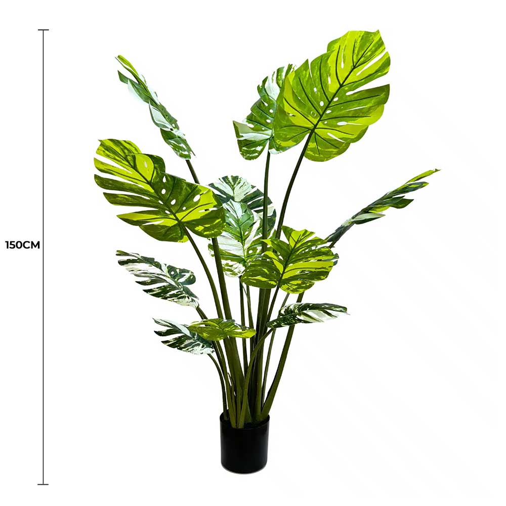 Artificial potted plant with green leaves and a height measurement on a white background