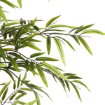 Artificial green leaves on a white background