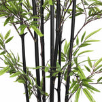 Artificial black bamboo plant with green leaves on a white background