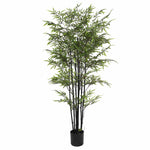 Artificial bamboo plant in a pot on a white background