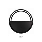Black circular shelf with dimensions on a white background