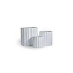 Chrome car exhaust tip on a white background