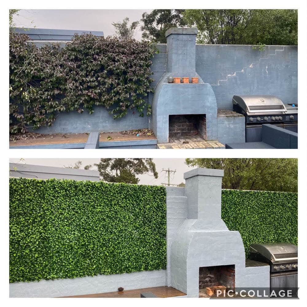 Outdoor barbecue area with stone-built barbecue and greenery in the background.