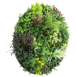 Artificial green wall with various types of plants on a white background