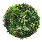 Round topiary ball with a variety of green plants on a white background