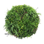 Artificial green wall panel with various green plants on a white background