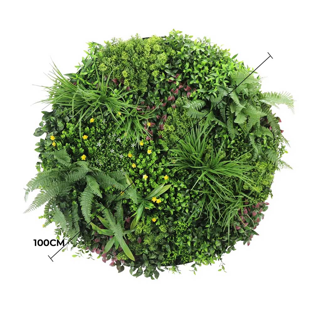 Artificial green wall panel with various green plants on a white background