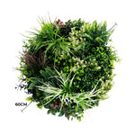 Artificial green wall with various plants on a white background