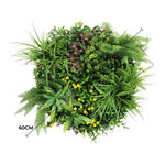 Artificial green wall with various plants on a white background