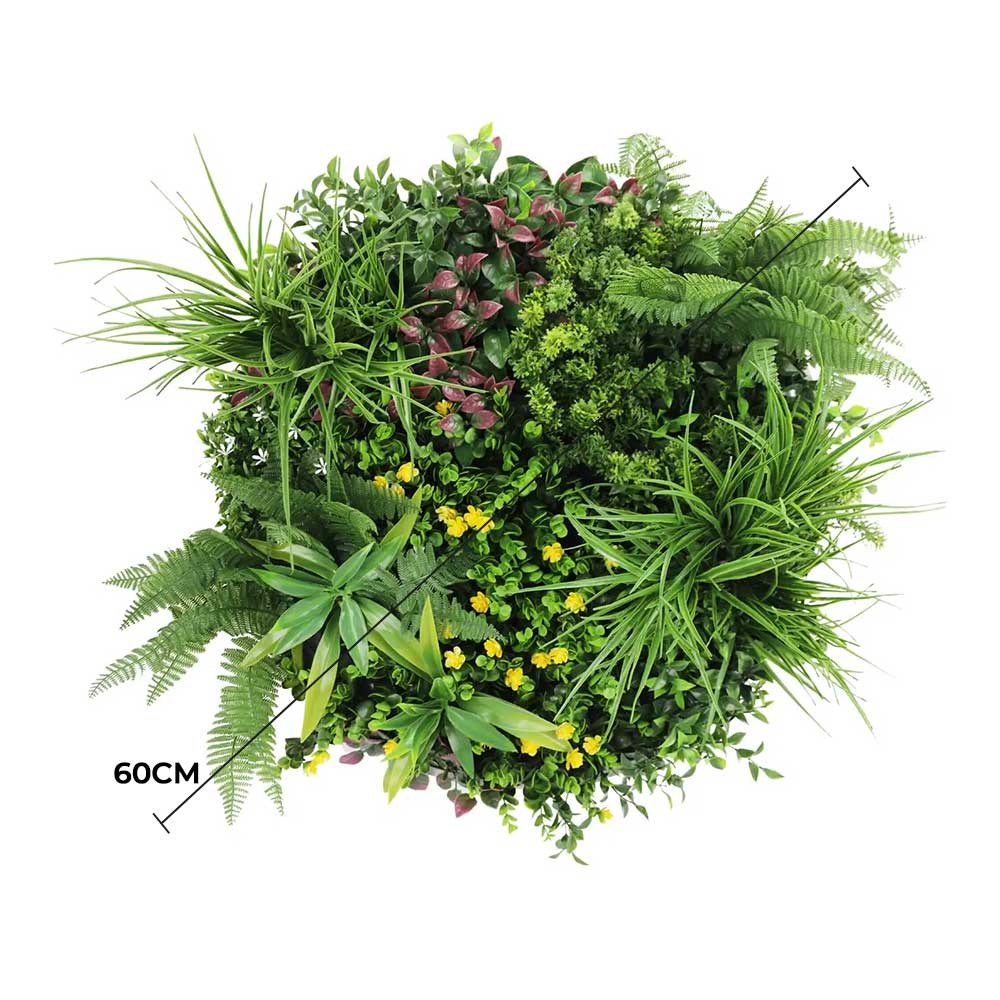Artificial green wall with various plants on a white background
