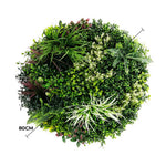 Artificial green wall with various plants on a white background