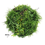 Artificial green wall panel with various plants on a white background