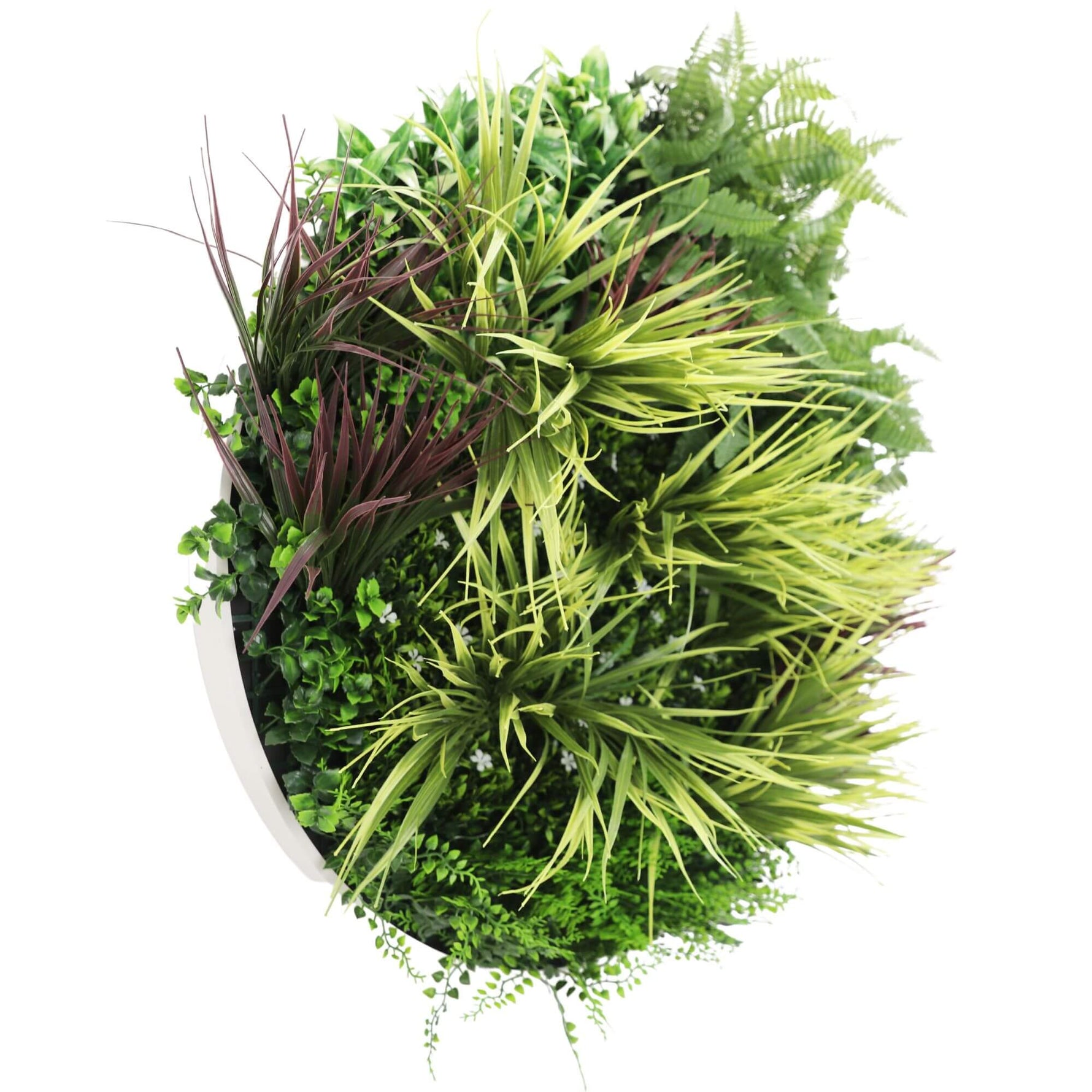 Artificial green plant ball with various types of foliage on a white background