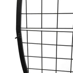 Close-up of a black metal grid against a white background