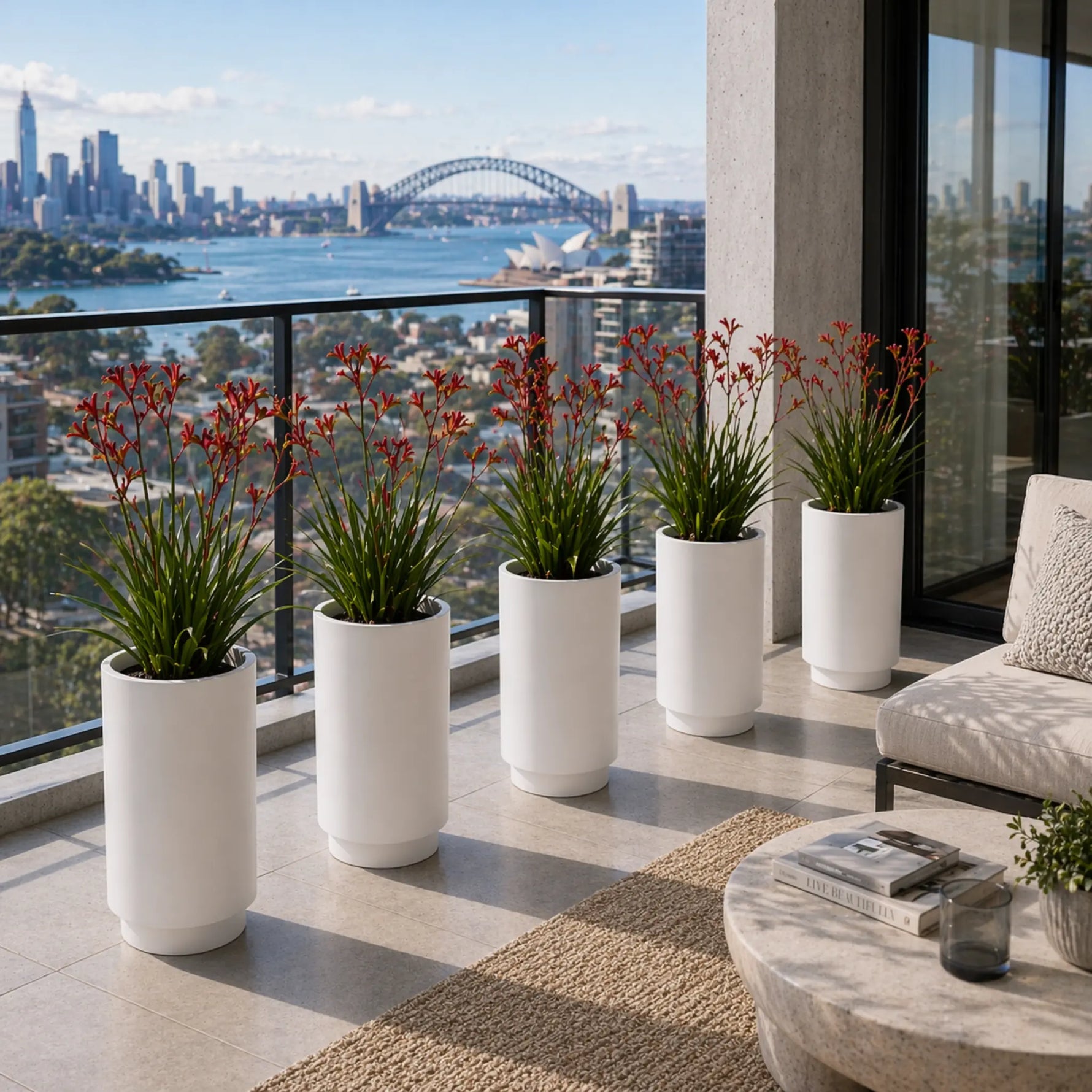 Modern patio with white planters and a cityscape view
