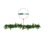 Green artificial Christmas garland with a close-up of the connector on a white background