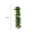 Artificial green leaf garland with measurements on a white background