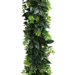 Artificial green leaf garland on a white background