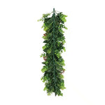 Artificial green leaf garland on a white background