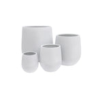 Set of four white ceramic pots on a white background