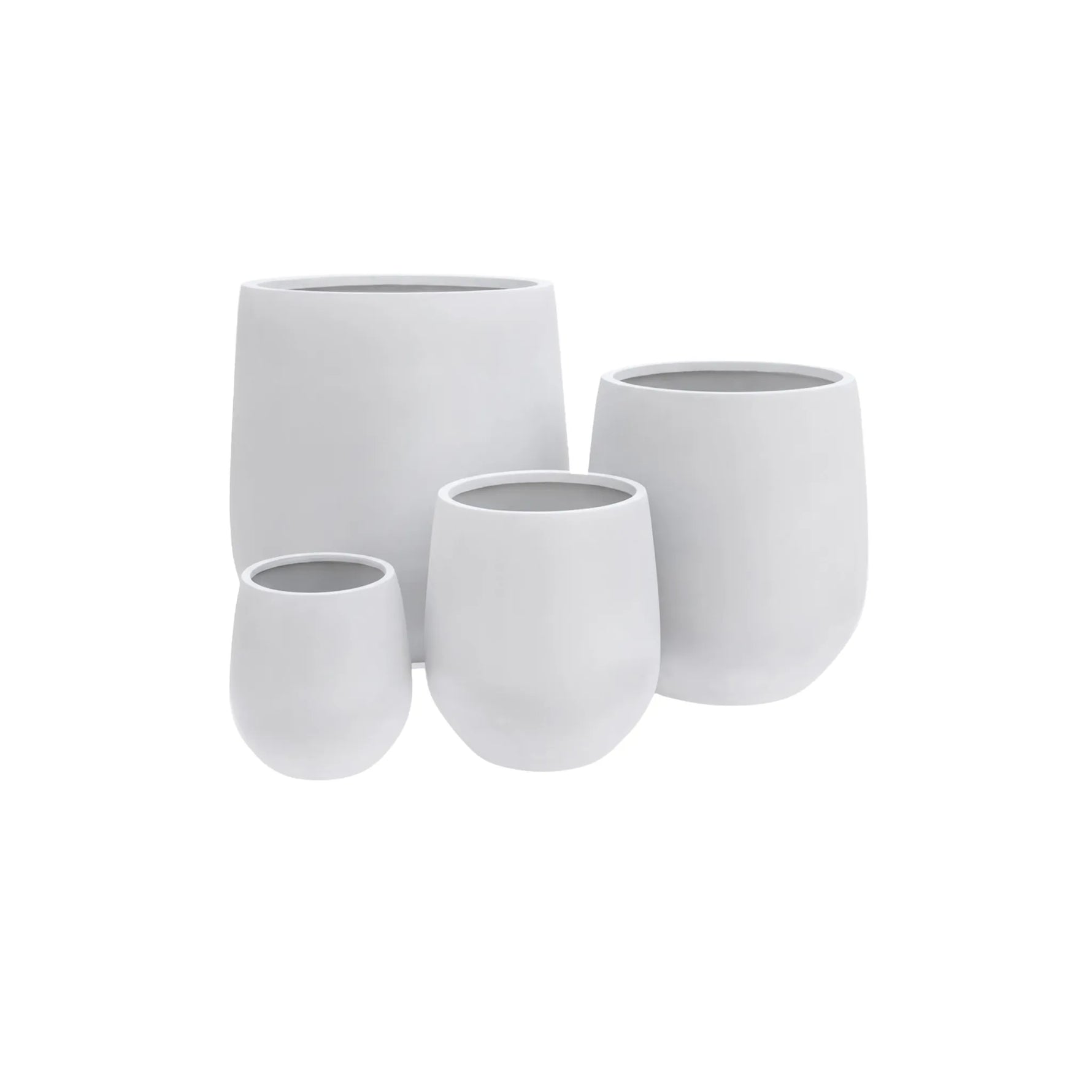 Set of four white ceramic pots on a white background